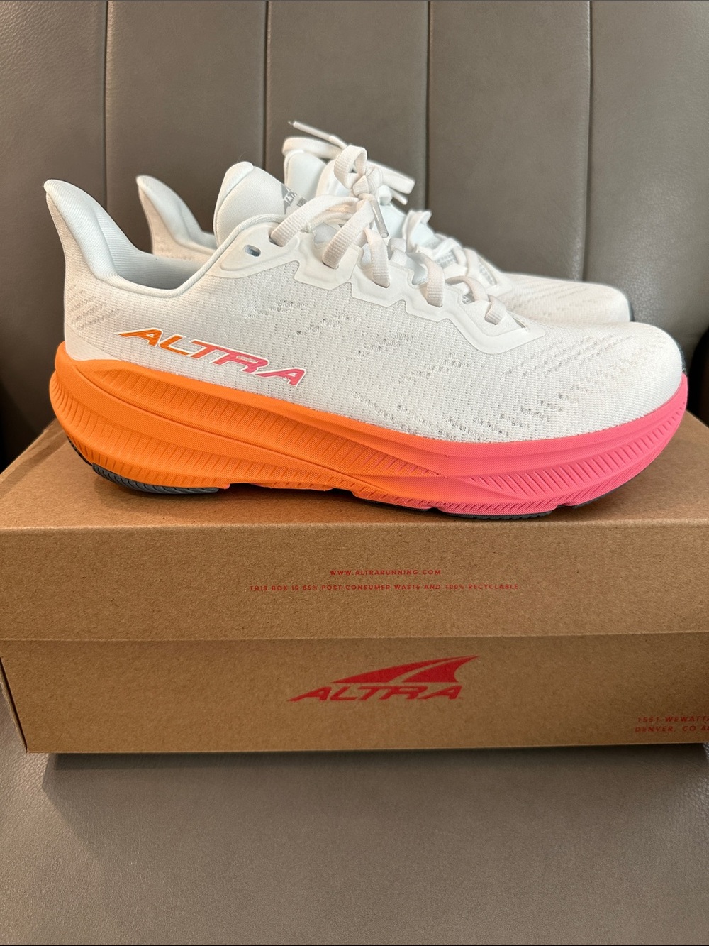 Altra White Running Shoes with Orange and Pink Gradient Sole